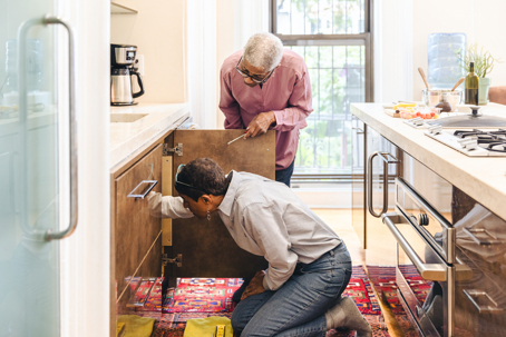 tech fixing plumbing