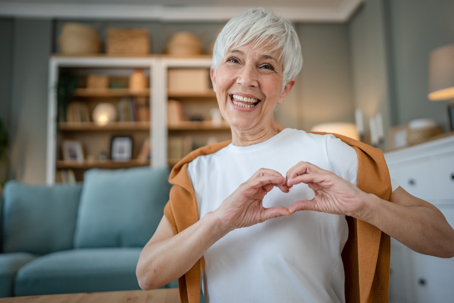 woman making heart hands