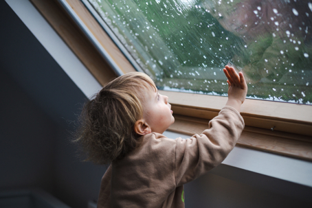 boy looking out window